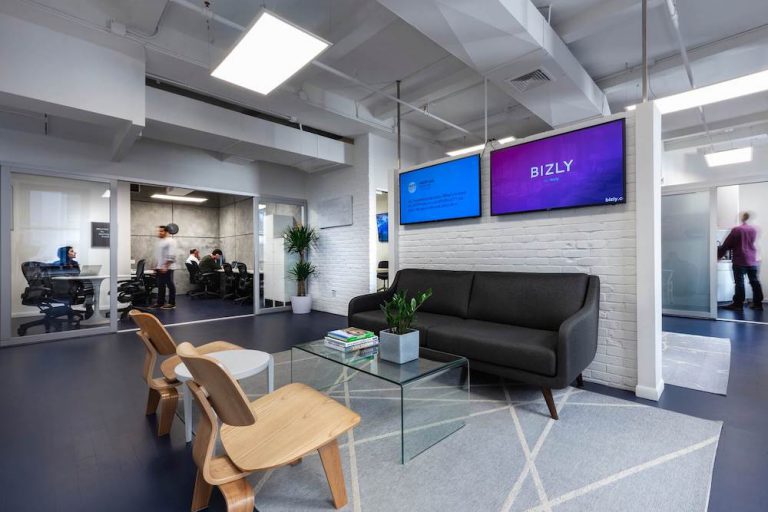 Office reception area with sofa and chairs