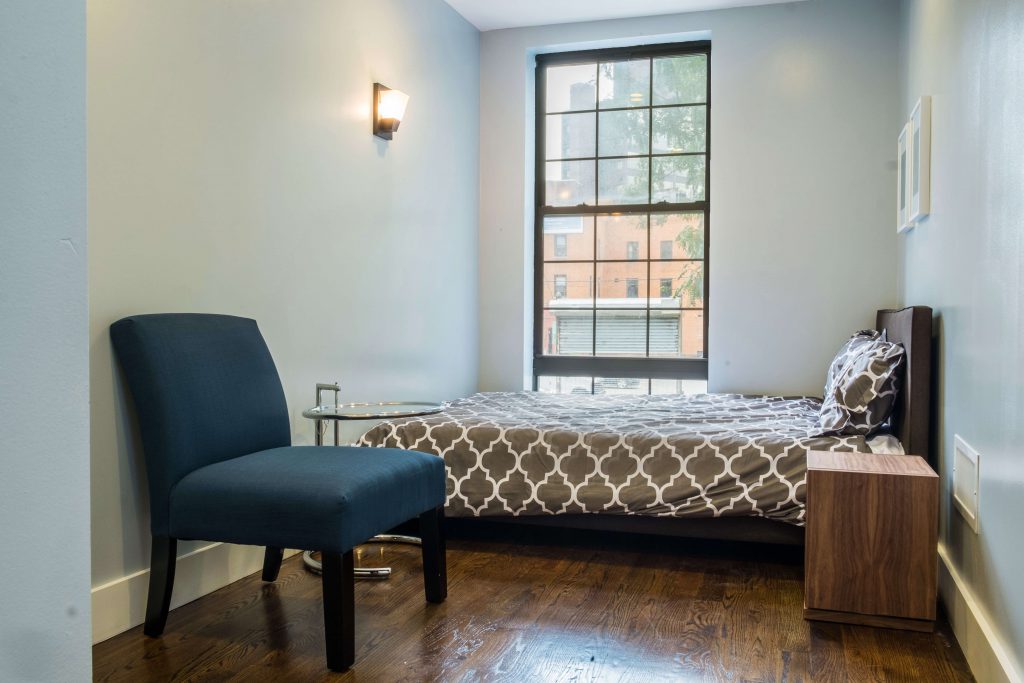 Bedroom with lounge chair and side table