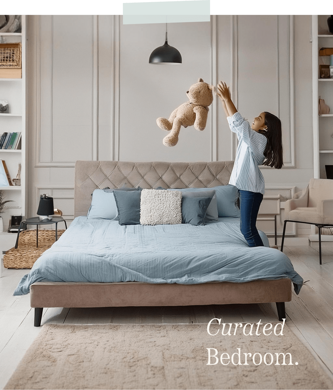 Girl throwing her teddy bear in the air while inside her bedroom