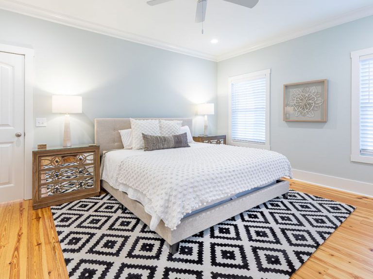 Large bedroom with patterned rug