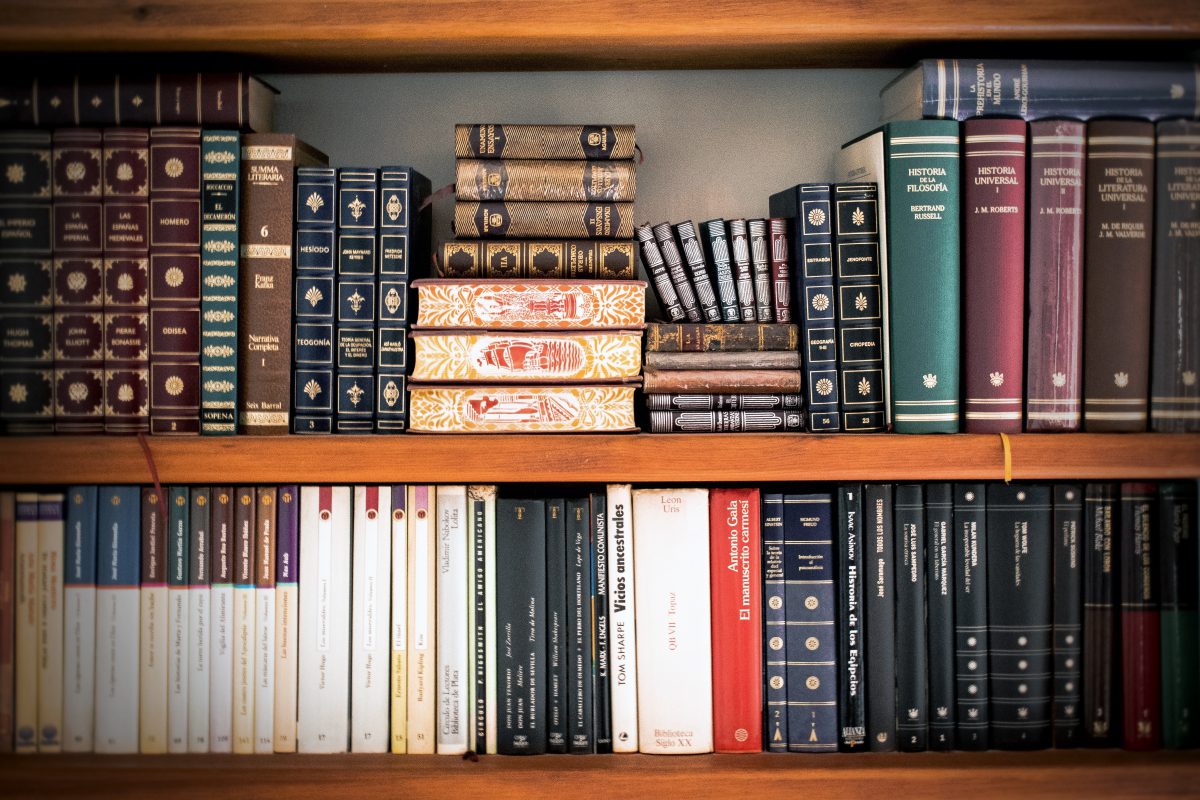 A bookshelf full of leather law books.