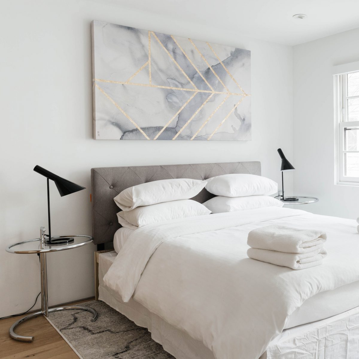 Bedroom with towels on bed