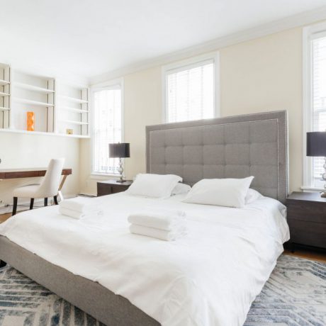Luxury guest bedroom suite with desk