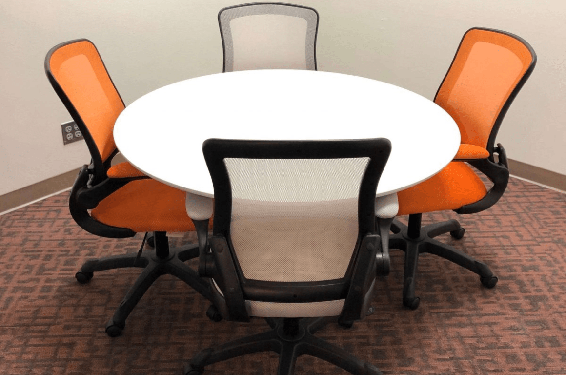 meeting room with a table and 4 chairs
